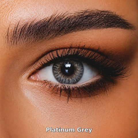 Bella One Day Platinum Grey coloured contact lens worn on a brown eye