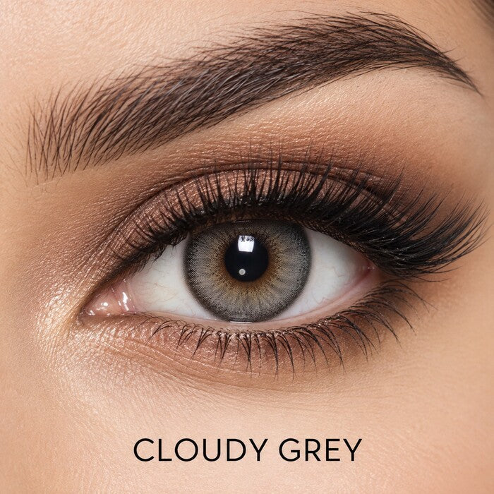 Bella Elite Collection Cloudy Grey coloured contact lens worn on a brown eye