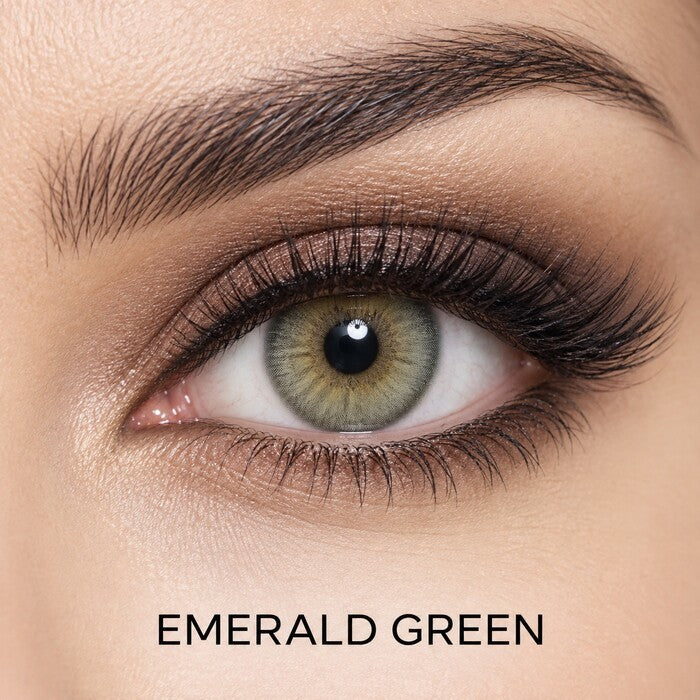 Bella Elite Collection Emerald Green coloured contact lens worn on a brown eye