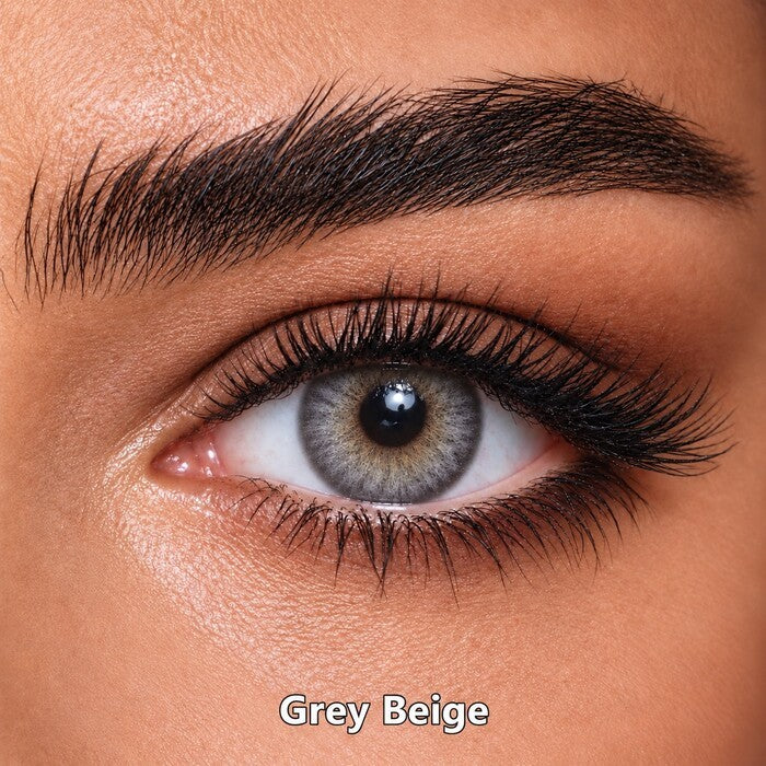Bella Elite Collection Grey Beige coloured contact lens worn on a brown eye