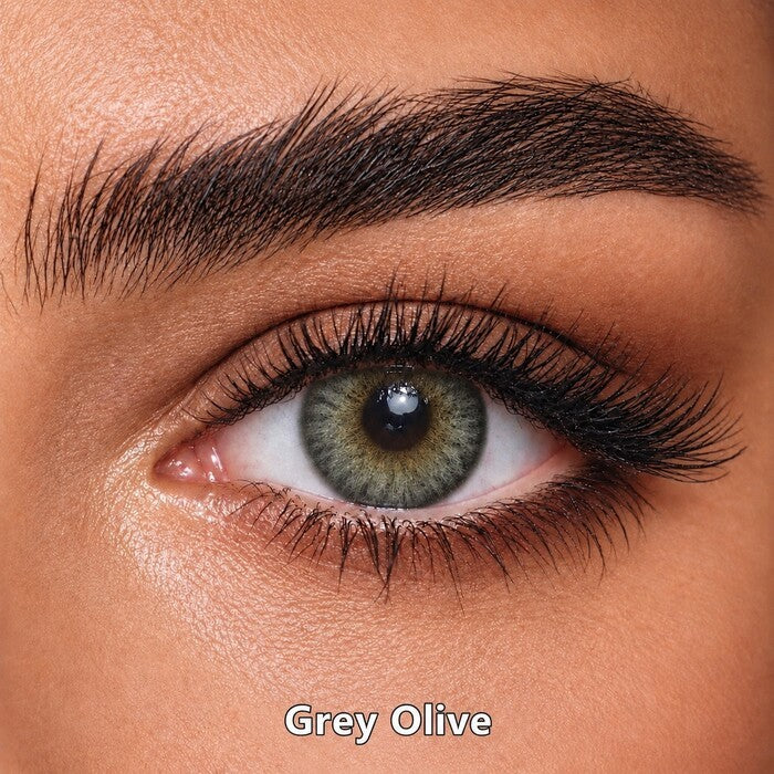 Bella Elite Collection Grey Olive coloured contact lens worn on a brown eye