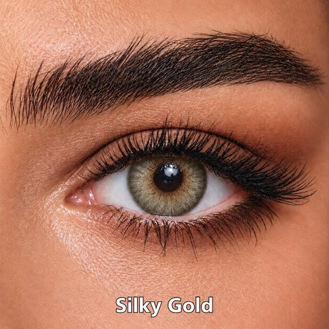 Bella Elite Collection Silky Gold coloured contact lens worn on a brown eye