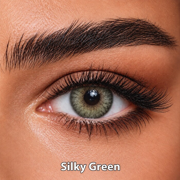 Bella Elite Collection Silky Green coloured contact lens worn on a brown eye