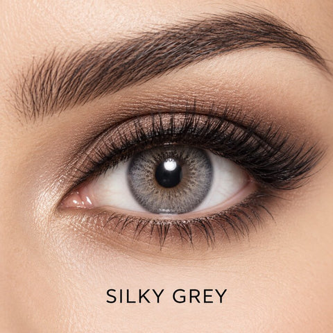 Bella Elite Collection Silky Grey coloured contact lens worn on a brown eye