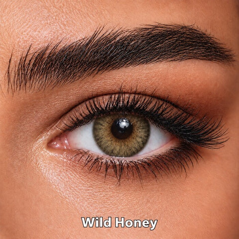 Bella Elite Collection Wild Honey coloured contact lens worn on a brown eye