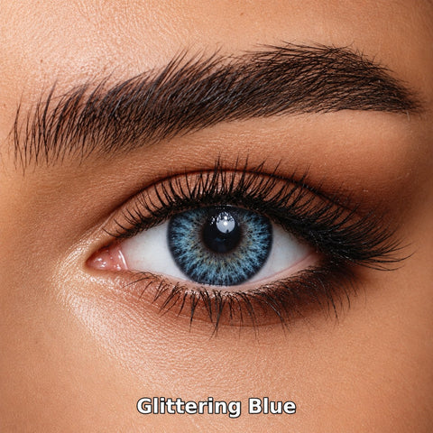 FreshKon Colors Fusion Glittering Blue coloured contact lens worn on a brown eye