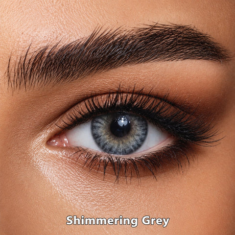 FreshKon Colors Fusion Shimmering Grey coloured contact lens worn on a brown eye