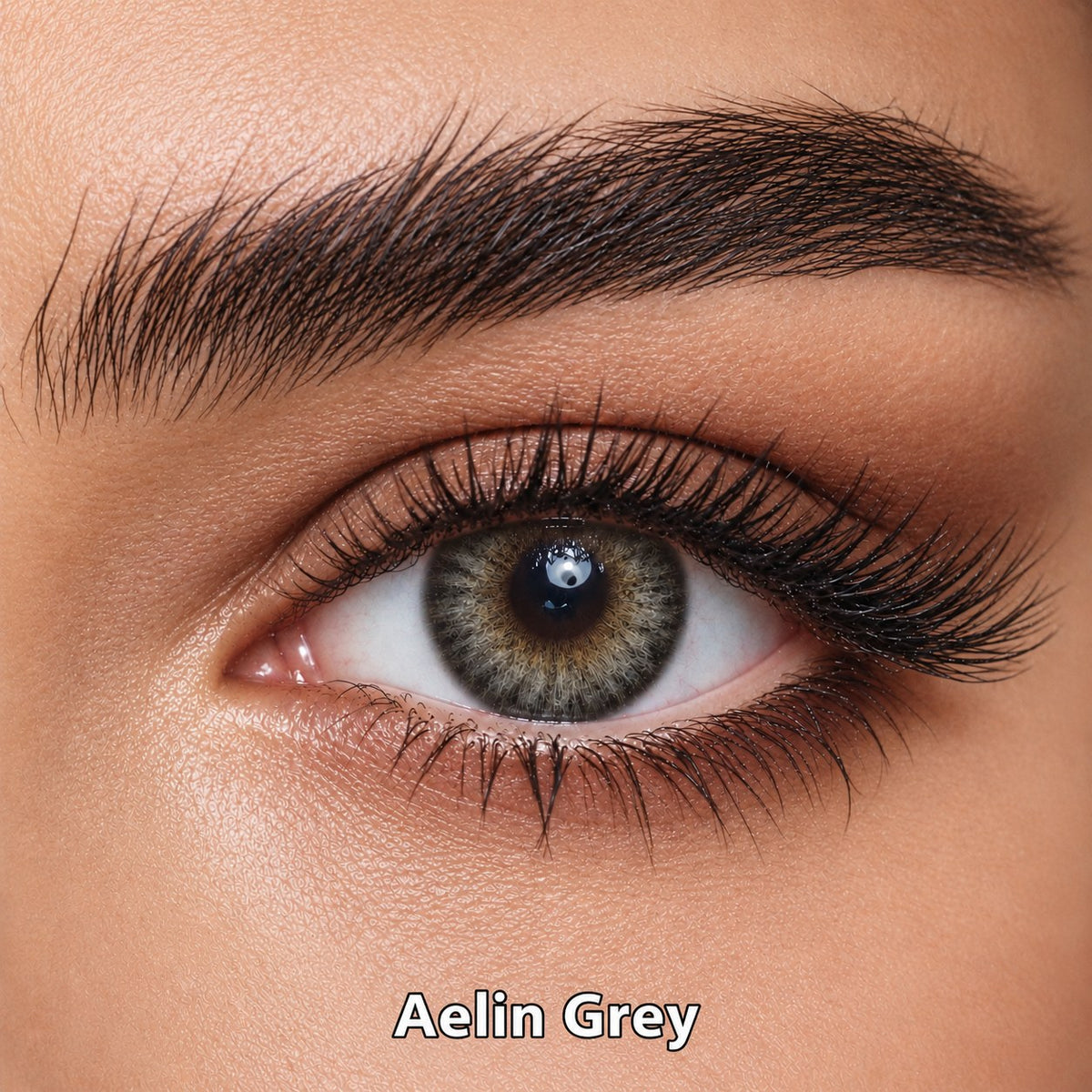 FreshKon Naho Aelin Grey coloured contact lens worn on a brown eye