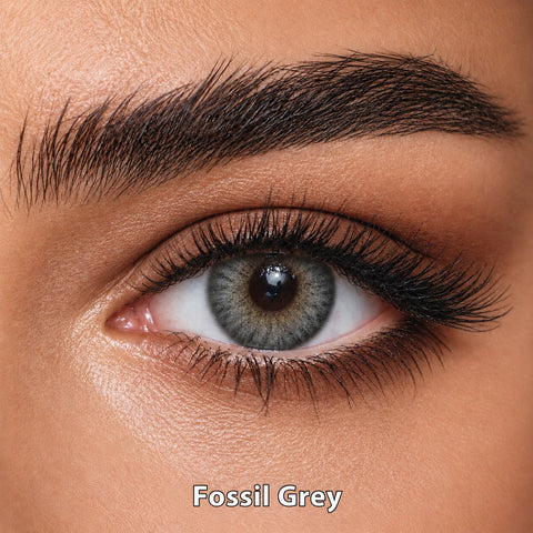 FreshKon Naho Fossil Grey coloured contact lens worn on a brown eye